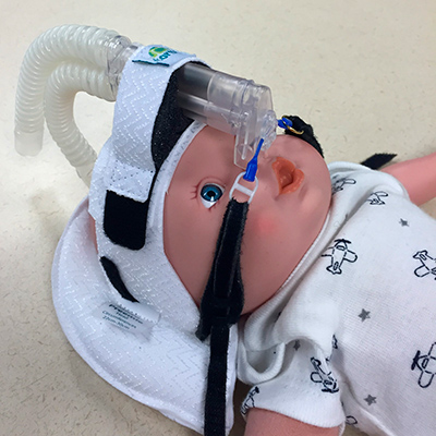 Tortle Midliner Head Positioner shown on infant